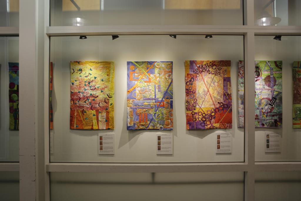 Photo of a rotating art exhibit of woven cloth in the terminal