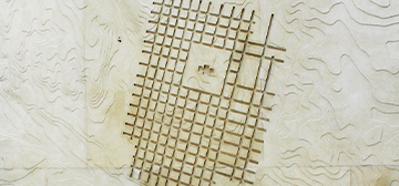 Grid-like imagery carved on limestone.