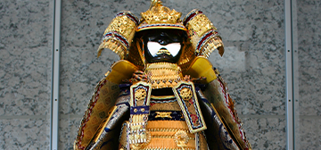 Traditional wood figurine with ornanate robe and headpiece