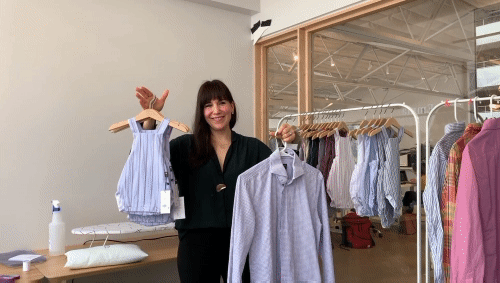 Classic Childhood owner Pamela Torres  shows an infant romper she made out of a men's dress shirt