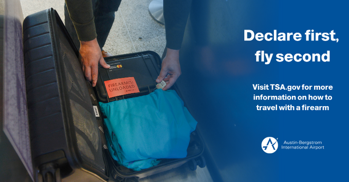 A traveler unloads their firearm case from their checked luggage bag to declare it at the ticket counter