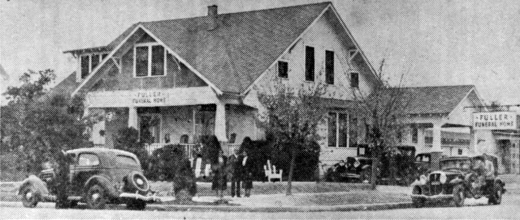 Fuller Funeral Home with cars and people in front on the sidewalk 