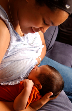 African American woman breastfeeding her baby