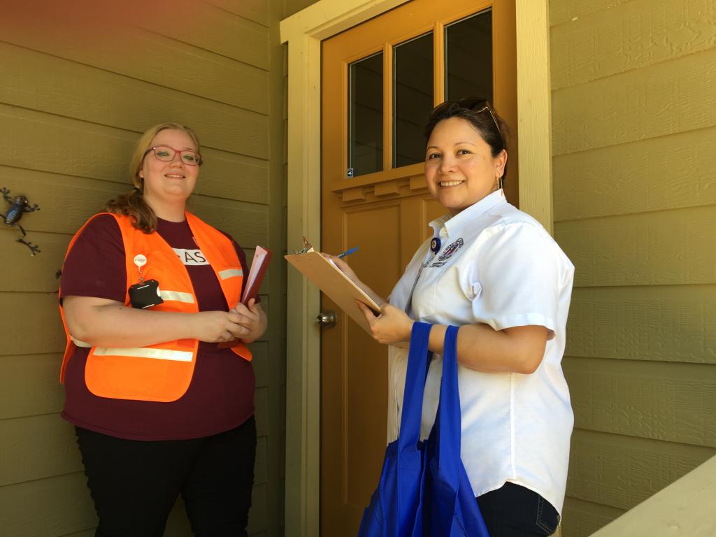 Members of the 2016 Zika CASPER team visit a resident's home.