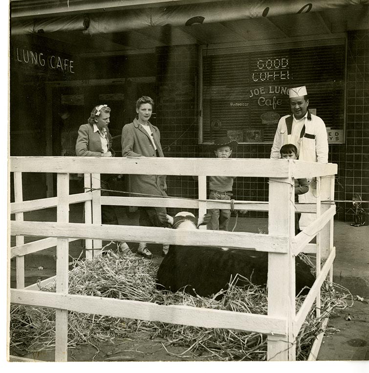 Sam Lung and Family in front of Joe's Cafe