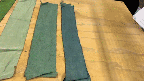Scraps of fabric are arranged by color