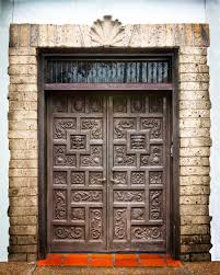 "photo of black walnut doors of the Spanish Governor's Palace"