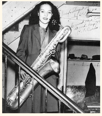 Miller holding saxophone