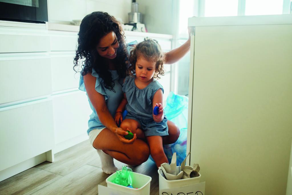 Mother and daughter recycling