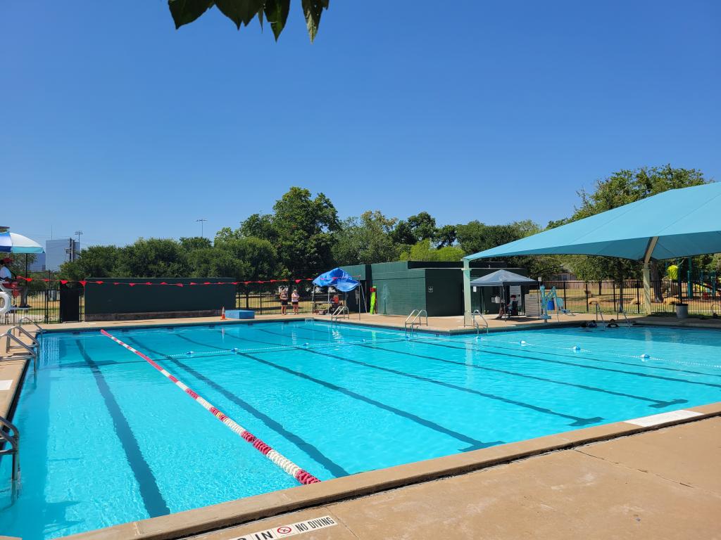 View of pool, lap lane, and covered shallow end. 