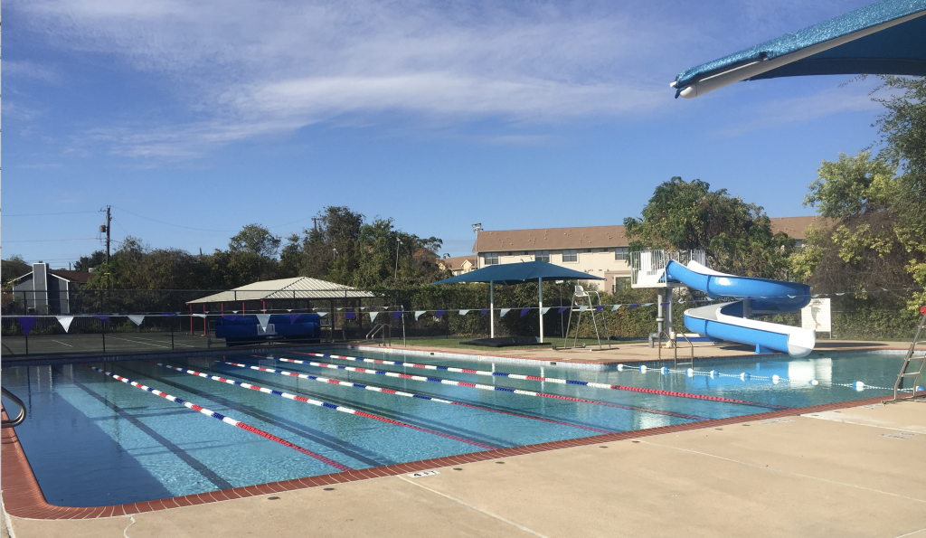 View of lap lanes and water slide at Springwoods Pool