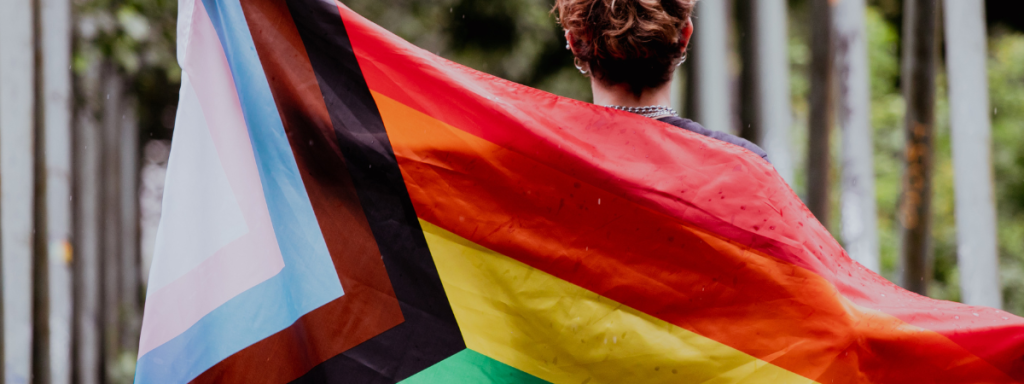 A person holding a pride flag