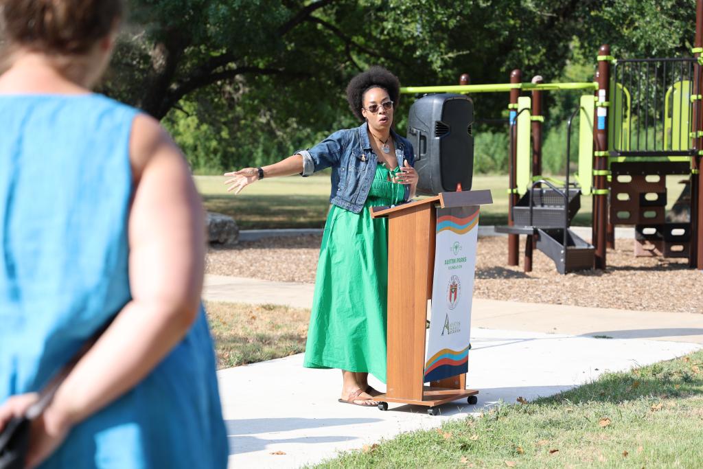 Samara Barks speaking at podium