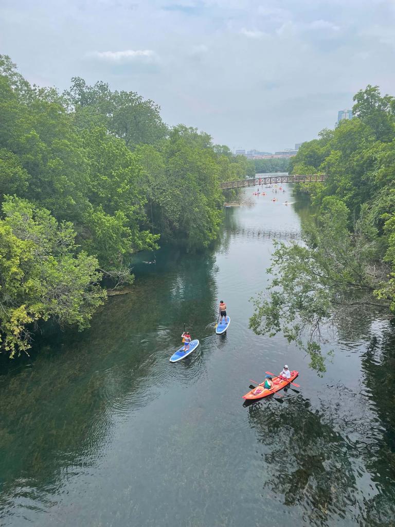 Boaters Under Bridge