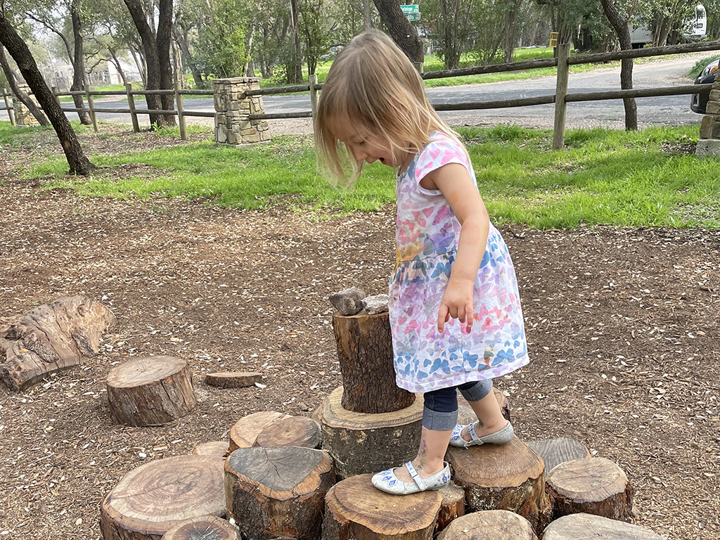 Child engaged in nature play