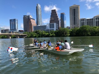 Rowers on a training barge