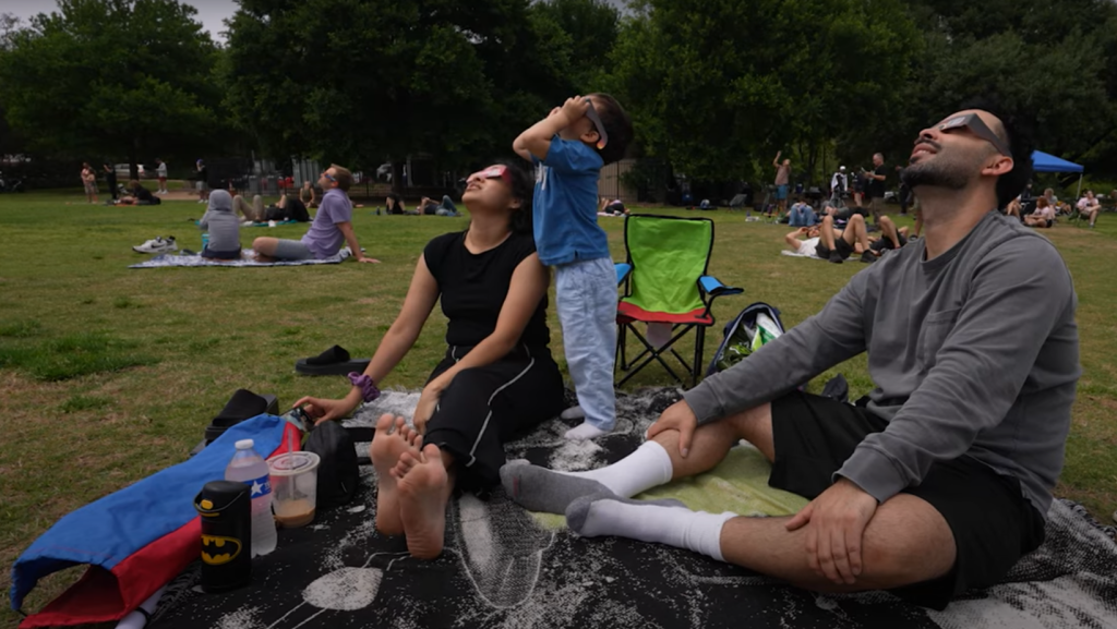 Family watching total eclipse 2024