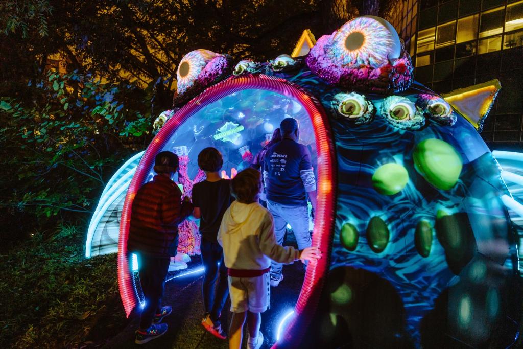 Visitors walk into The Creek Keeper, a walk-through art installation resembling an aquatic creature.