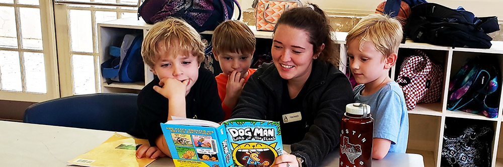 Staff reading to children