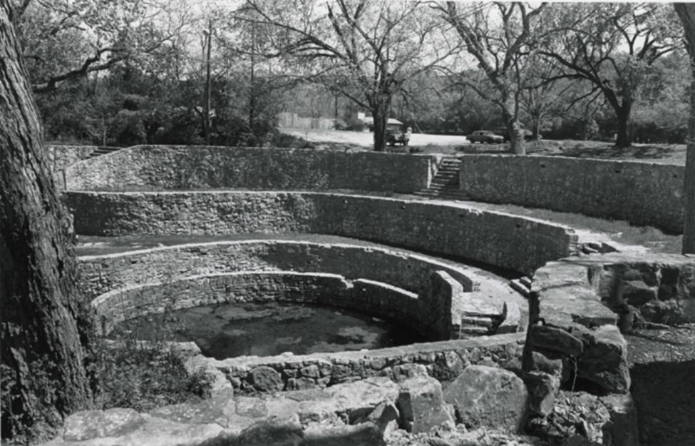 Black and white historic photo of the Sunken Garden and stone wall structure, date unknown