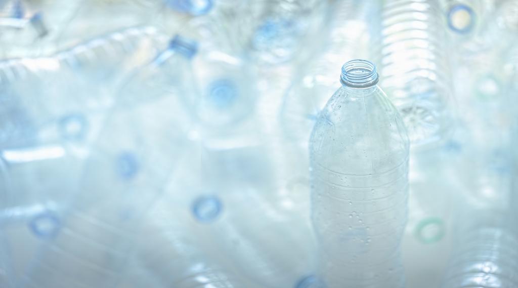 A close up of multiple plastic water bottles.