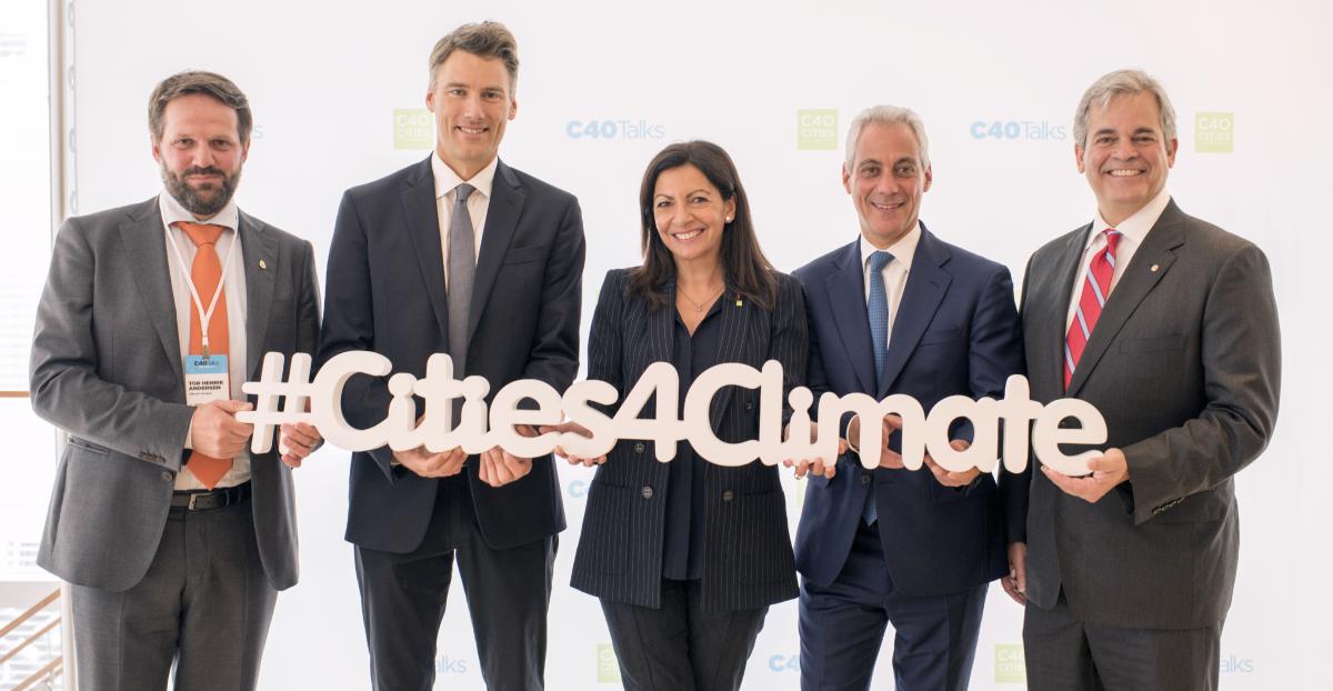 Mayor Adler with other leaders holding "Cities 4 Climate" sign