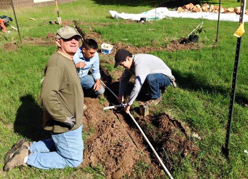 Photo of people working on a garden