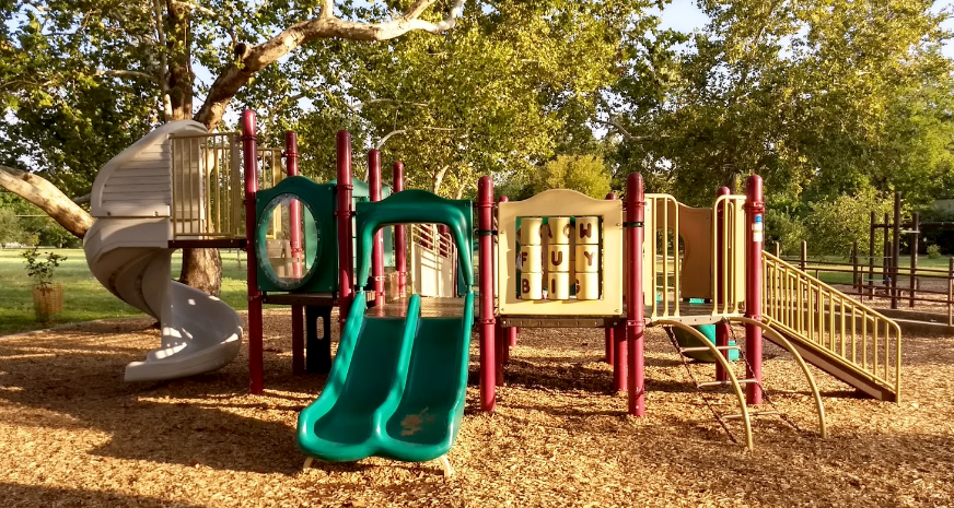 Playscape with green double slide and changeable letters.