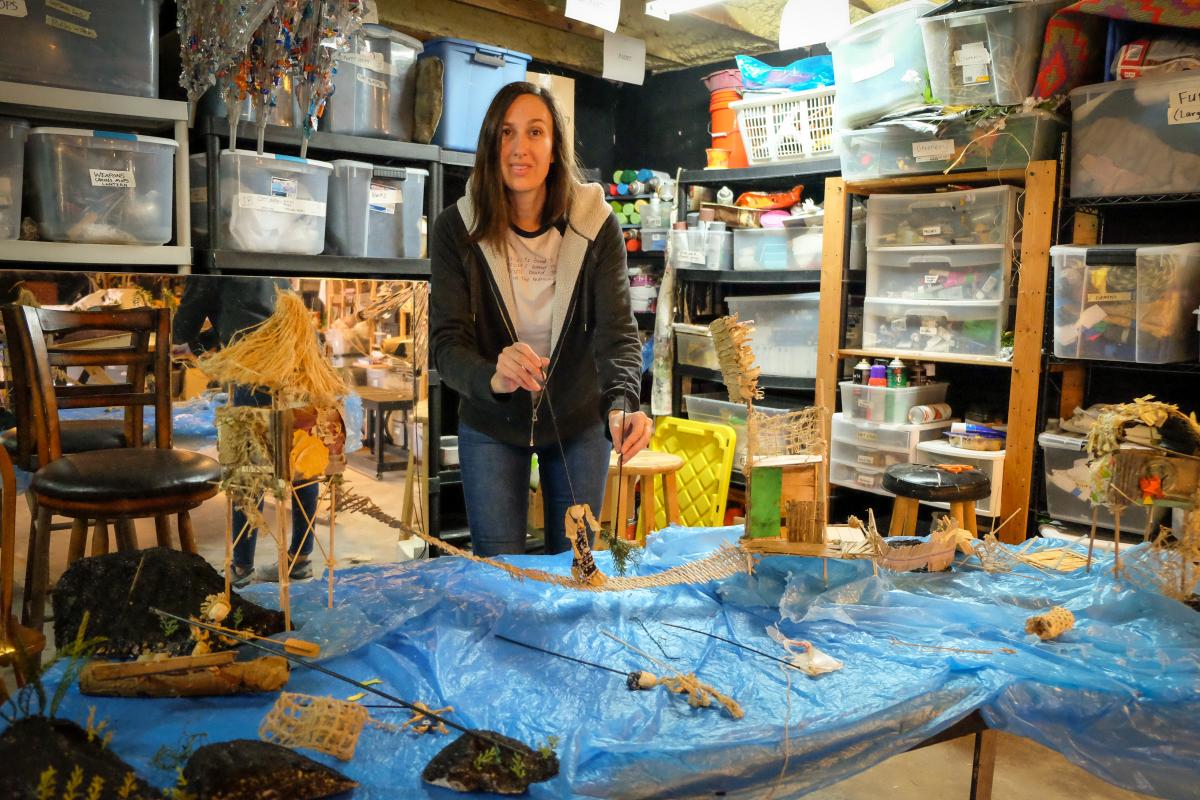 Caroline in her workshop demonstrating how to manipulate the puppets.