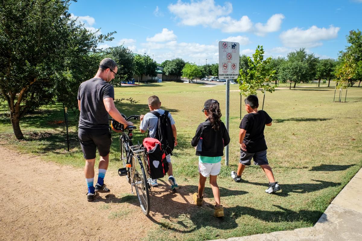 Chris Stanton leads a group of kids out to the bicycle track.