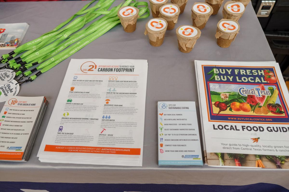 Outreach materials on a gray table.