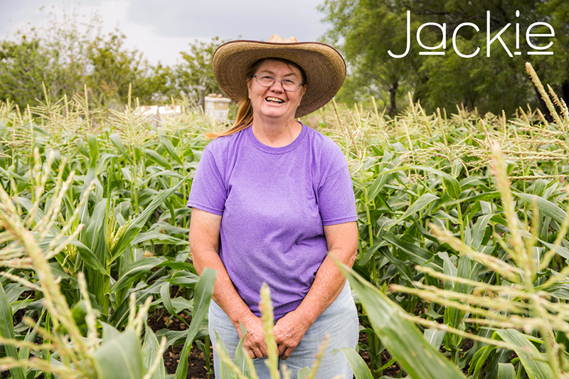 Jackie wearing a sun hat in a field.