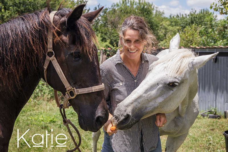 Katie with two horses.