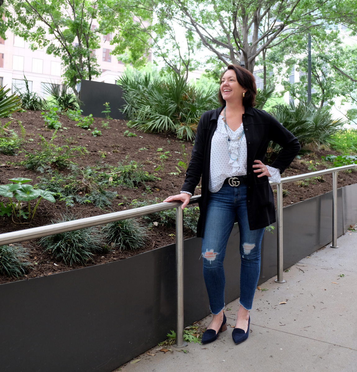 Photo of Laura Huffman with greenery in the background