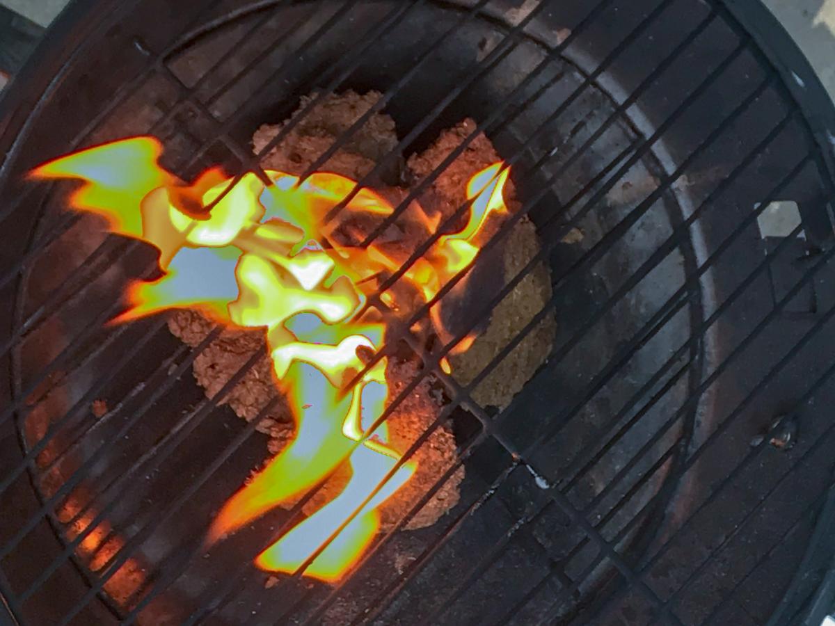 Close up of waste material in a fire pit.