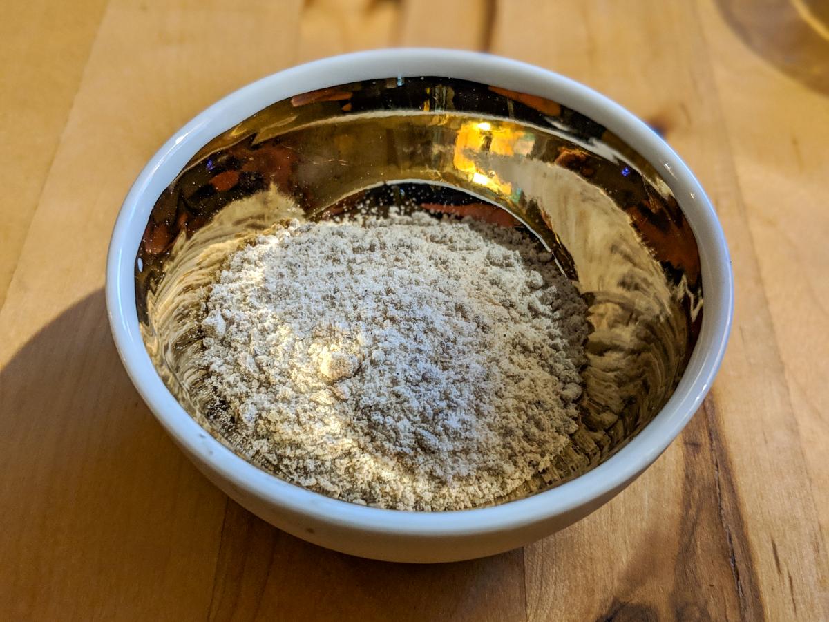 Finished vanilla sugar in a shiny bowl.