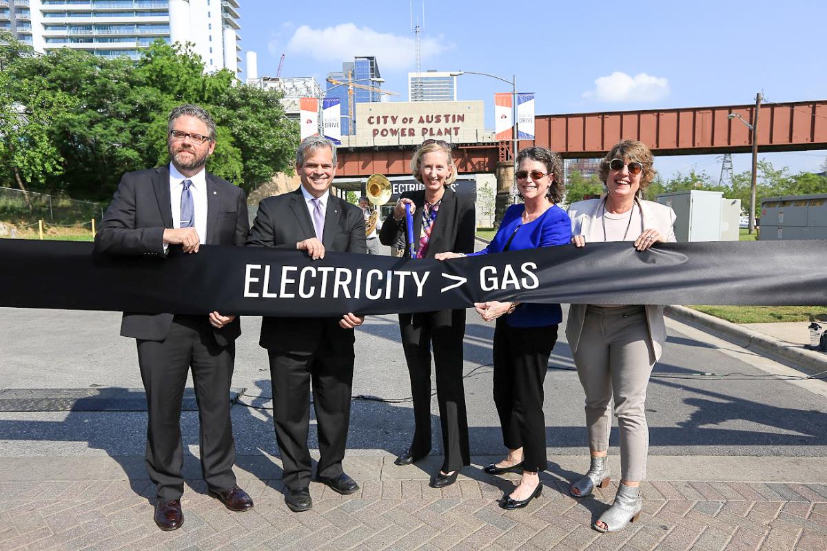 City officials about to cut the ribbon for Electric Drive.