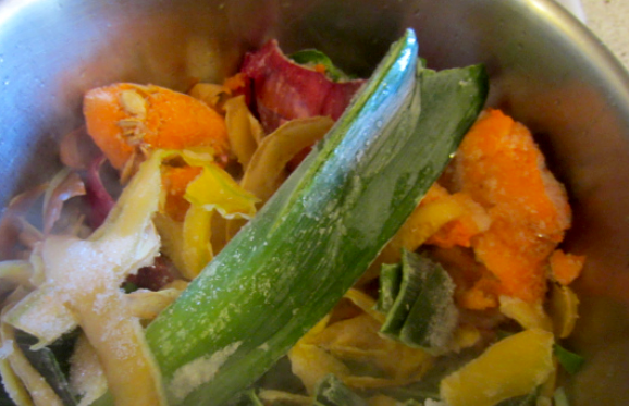 Veggie scraps in a pot.