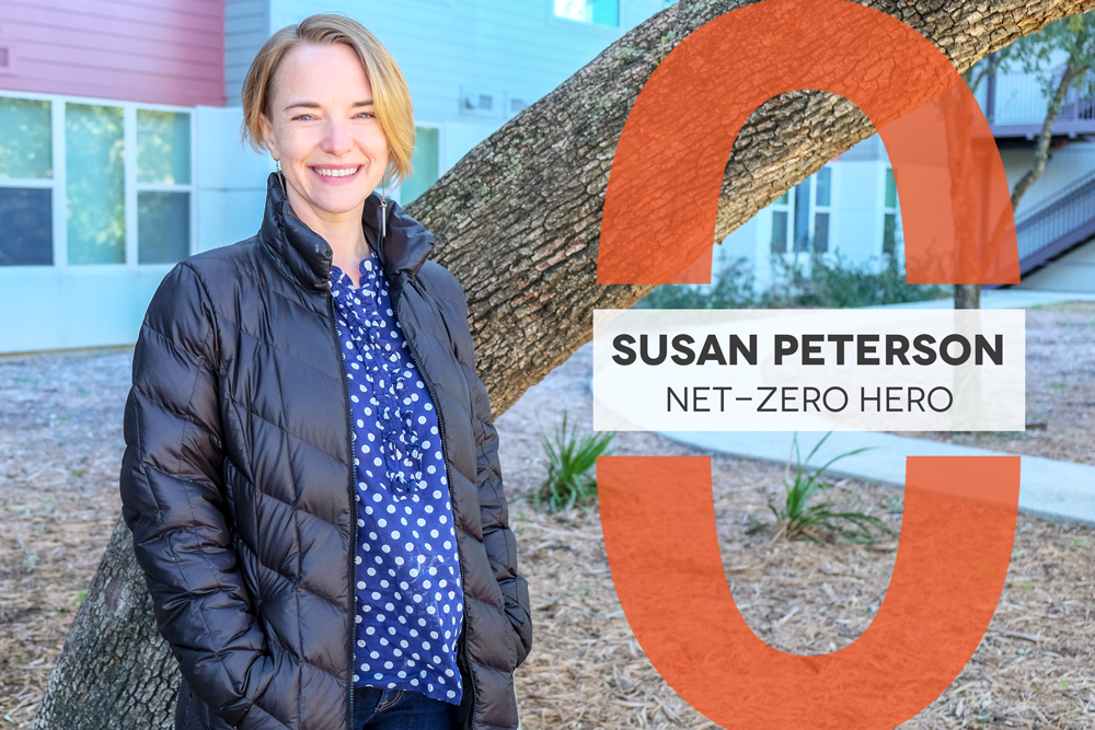 Photo of Susan Peterson in a black jacket and blue and white polka dot top. Text reads: Susan Peterson Net-Zero Hero