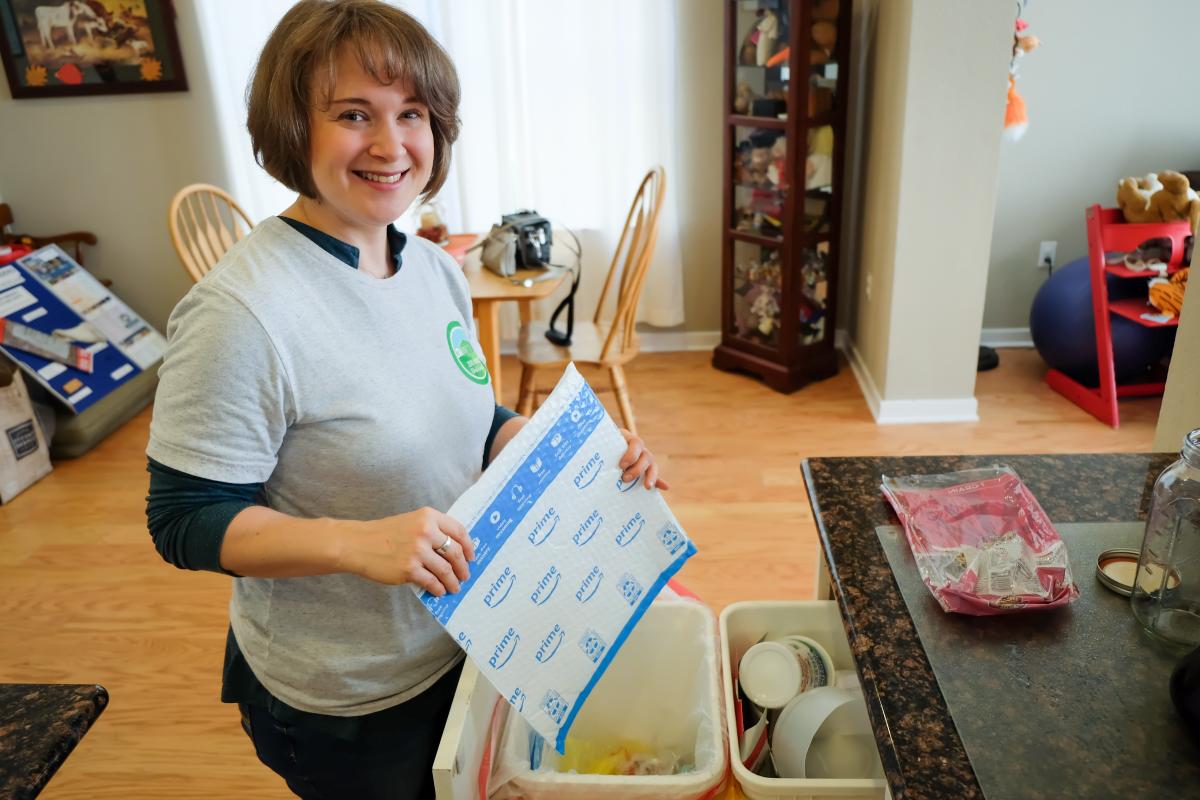 Taylor holding up a recyclable plastic package.