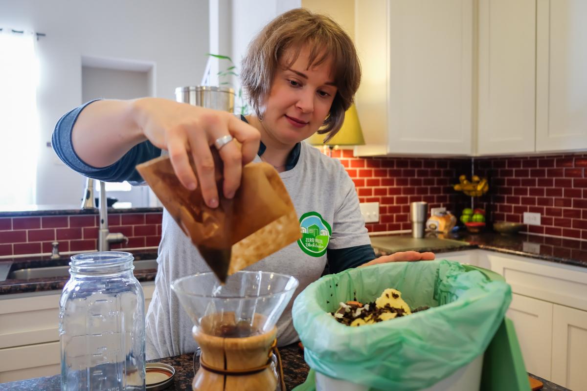 Taylor about to compost a coffee filter.