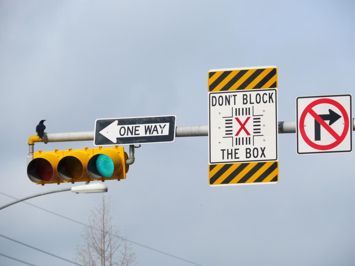 Photo of Don't Block the Box sign on a traffic signal.