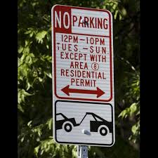 Photo of a residential permit parking "no parking" sign.