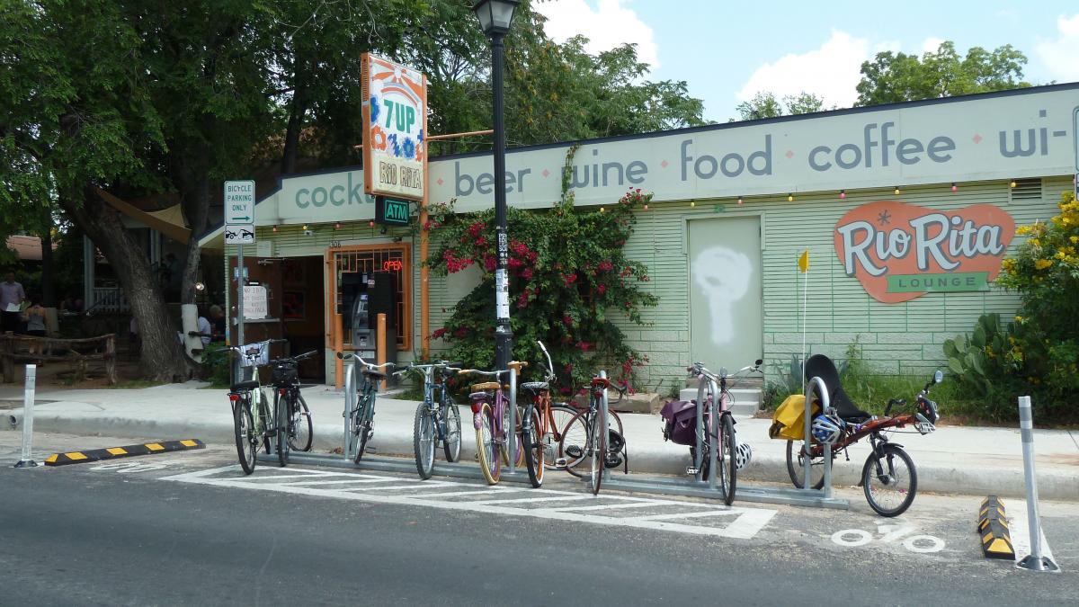 A bike corral takes place of what was previously an on-street parking space in front of Rio Rita.