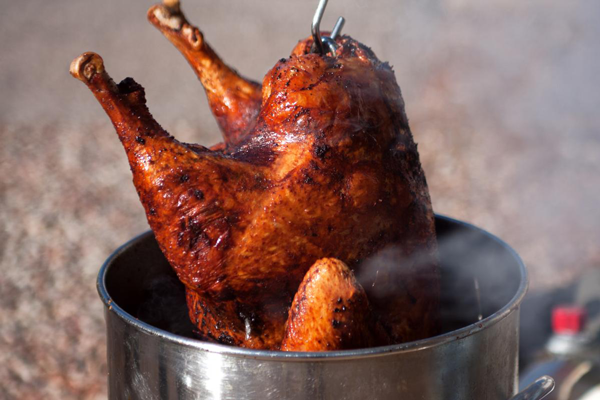 image of a turkey frying in a pot