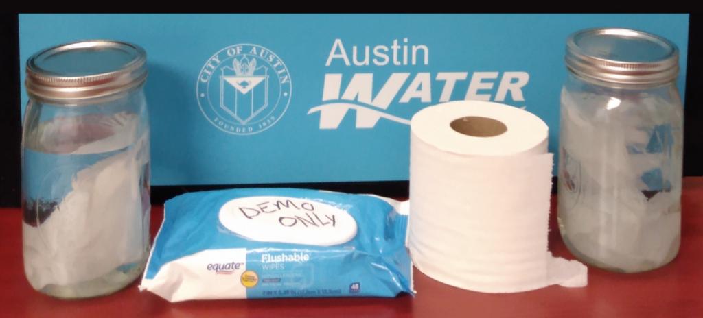 Image of toilet paper roll, mason jars, and non-flushable wipes.