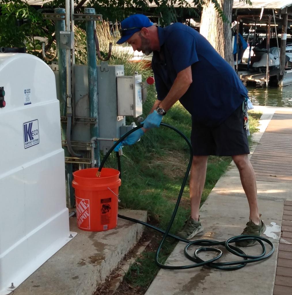 man filling 5 gallon bucket