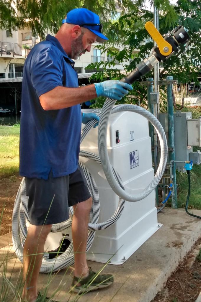 man uncoiling hose