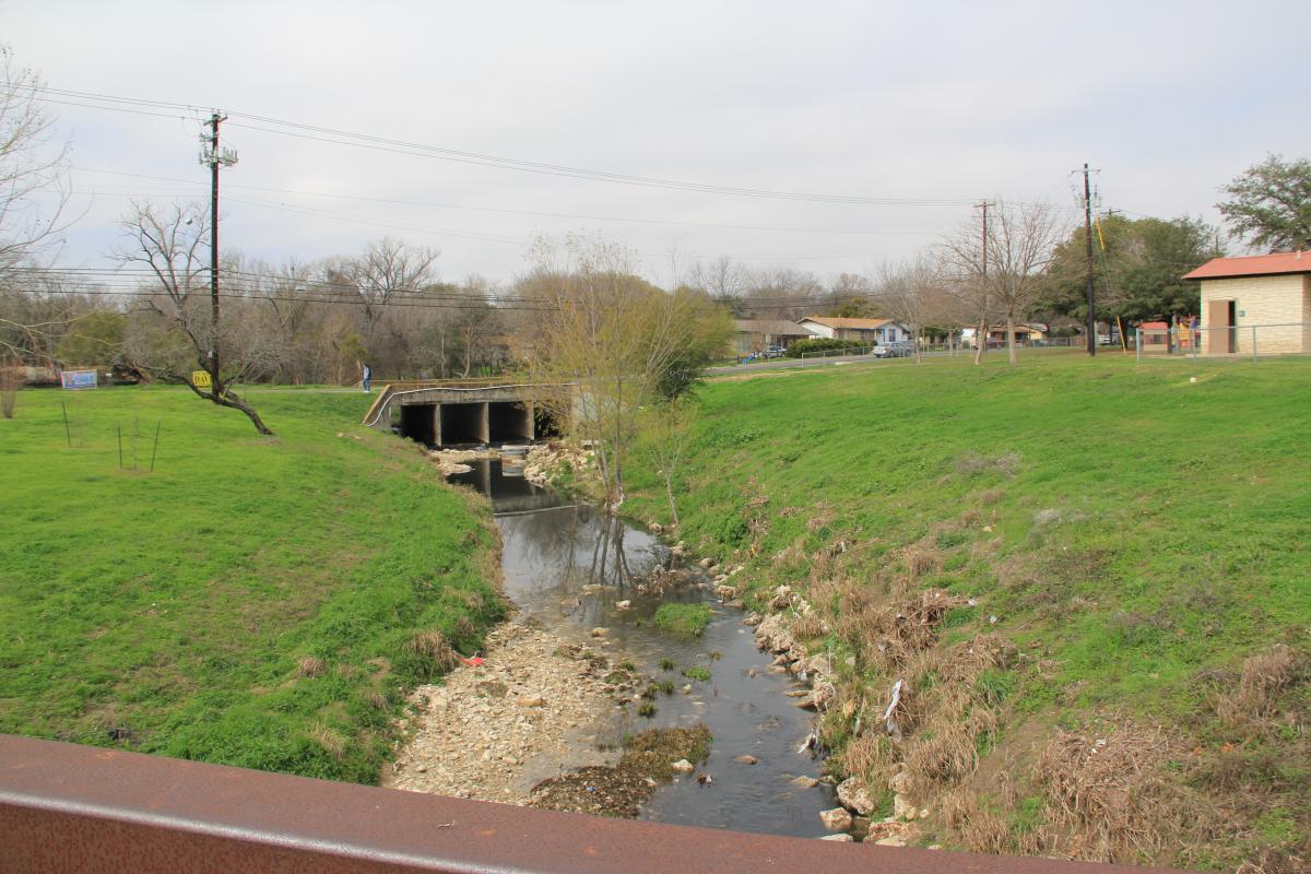 A creek mowed all the way into the channel.