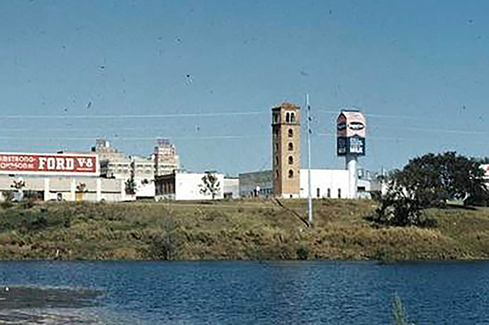 Note the lack of thick shoreline vegetation in front of Buford Tower (on the north side of Lady Bird Lake, between South 1st Street and Congress Avenue) before the river was dammed. This photo is undated but is likely from the 1950s.